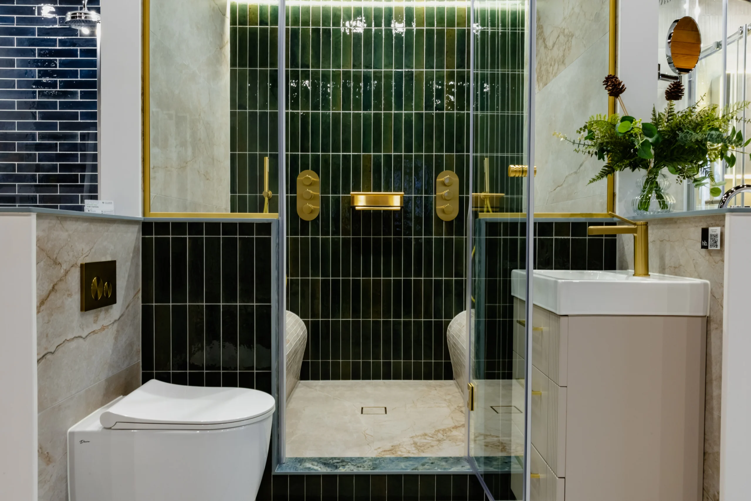 Tiled wet room on display in the Newlook Tiles and Bathrooms Dublin showroom, with an open shower area and fully tiled walls and floor