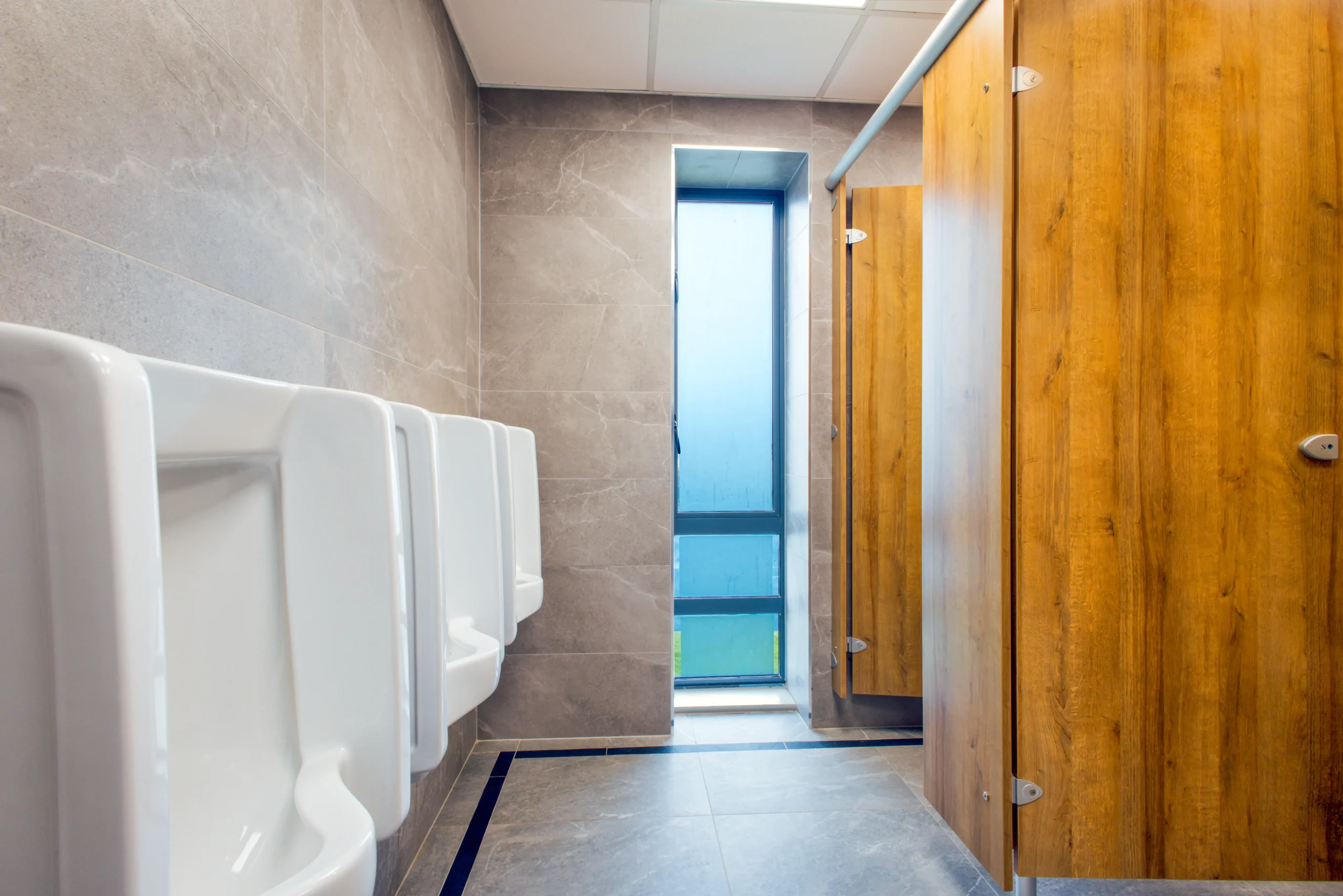 Commercial gents bathroom renovation project by Newlook Tiles Dublin
