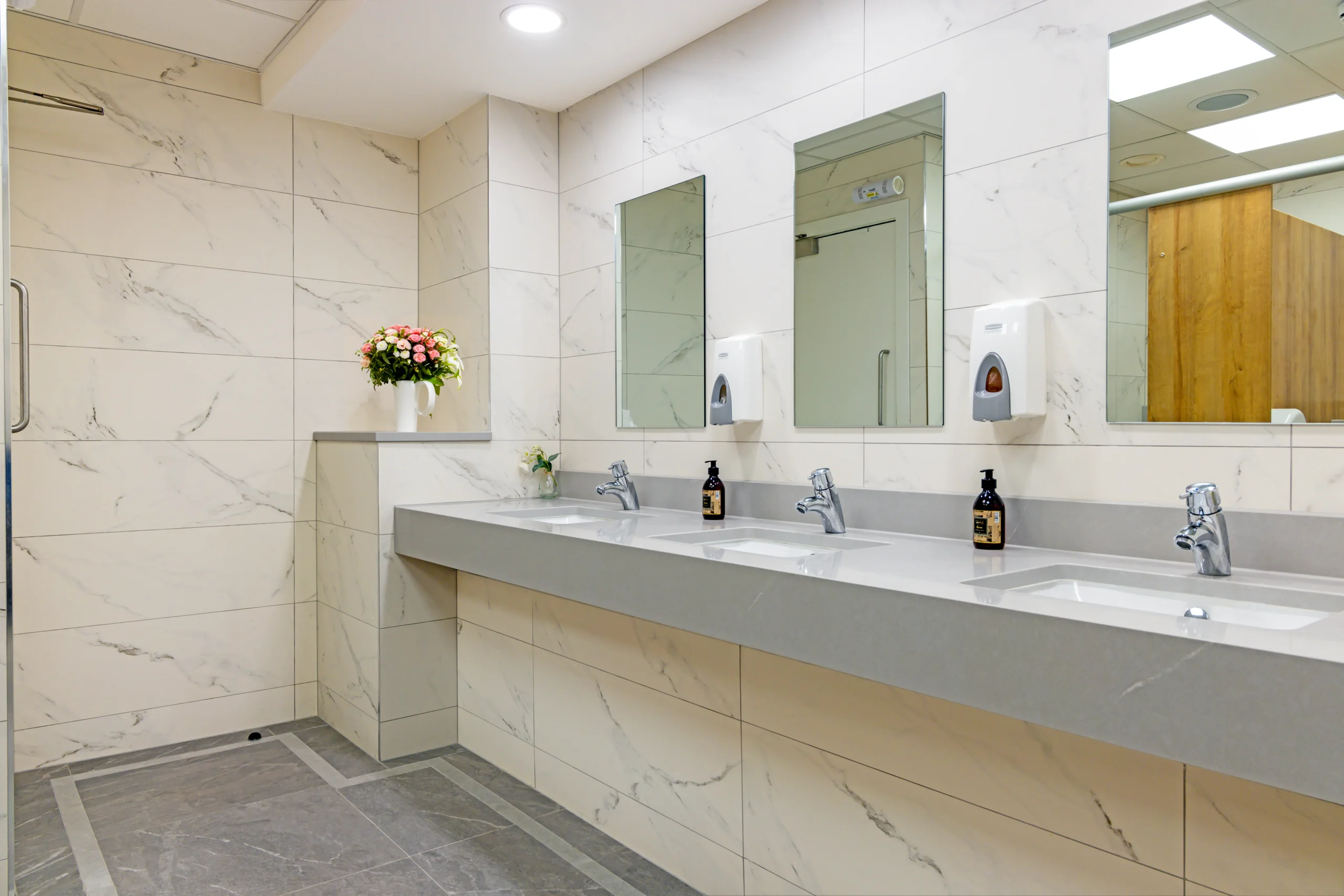 Commercial ladies bathroom renovation project by Newlook Tiles Dublin
