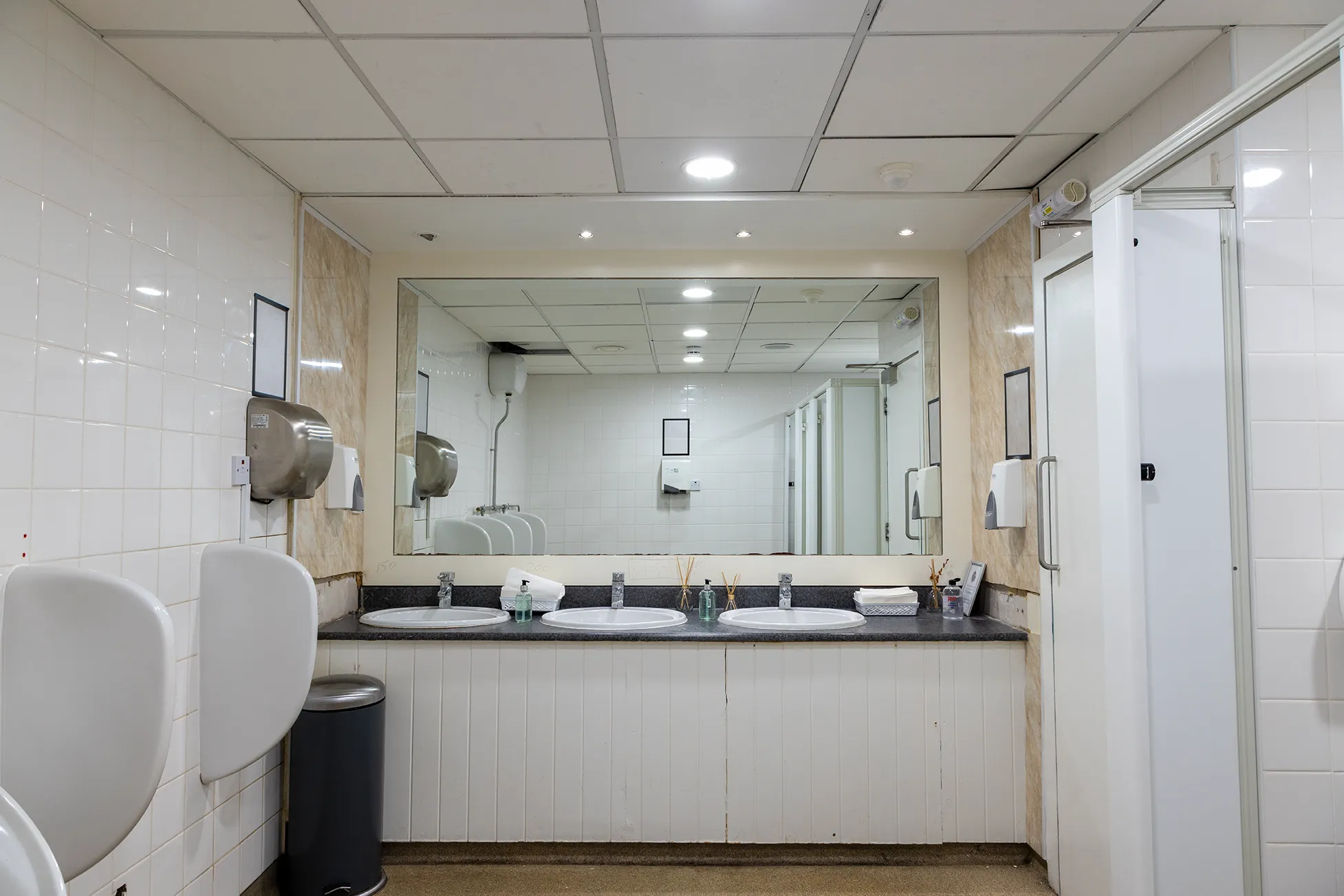 Completed bathroom renovation with tiled wall finishes and fitted bathroom products