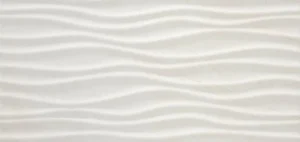 White ceramic décor tile featuring raised undulating wave relief texture