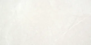 White marble-effect ceramic tile with soft grey veining across the surface