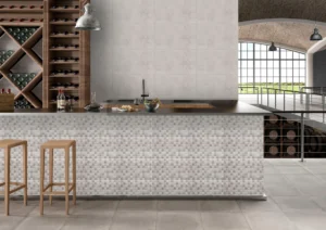 Kitchen bar with small square mosaic tile surround and large grey wall tiles
