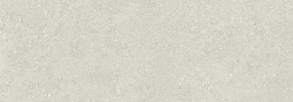 Wide cream ceramic tile with a coarser granular stone-look texture