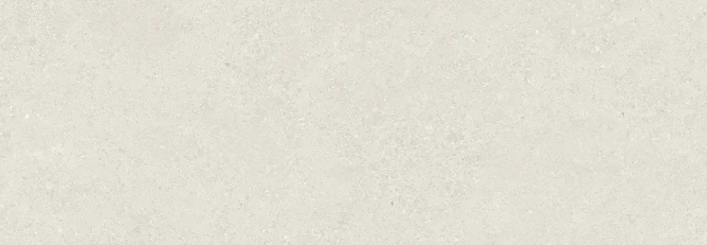 Pale white ceramic wall tile showing soft mottled stone-effect surface