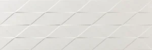 Ivory ceramic décor tile with diagonal raised triangle geometric pattern