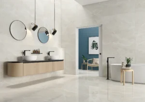 Bright bathroom with glossy sand marble-effect wall and floor tiles, double basin vanity
