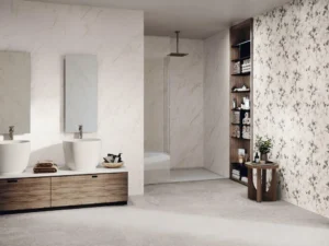 Spacious bathroom combining white marble wall tiles with a botanical floral décor panel