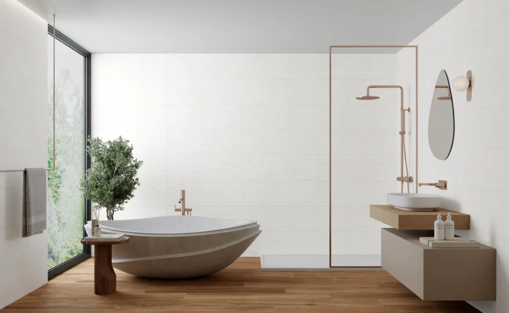 Minimalist bathroom with white wall tiles, freestanding stone bath and brass fittings