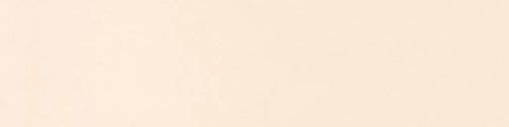 Plain ivory ceramic wall tile with a soft warm finish, wider view