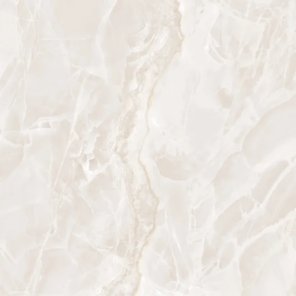 Glossy ivory ceramic wall tile with flowing onyx-inspired veining in warm white tones