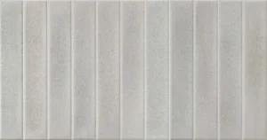 Light grey-beige ceramic wall tile featuring vertical ribbed linear texture