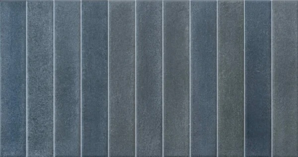Dark navy blue glossy ceramic tile with vertical ribbed relief surface