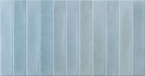 Soft sky blue glossy ceramic tile with vertical grooved stripe relief
