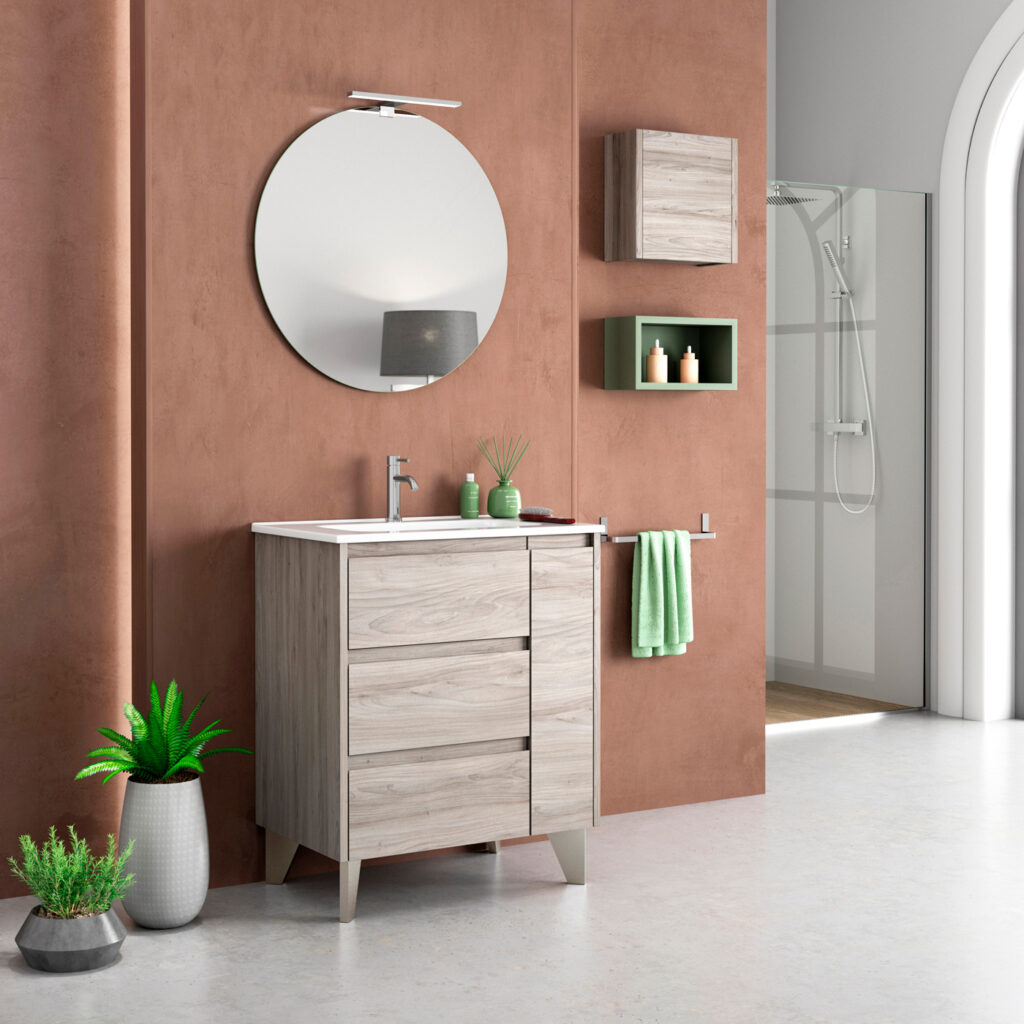 Grey pine freestanding vanity unit with drawers, round mirror and wall cabinet on terracotta wall