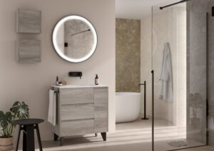 Grey wood effect freestanding vanity unit with round LED mirror beside walk-in shower