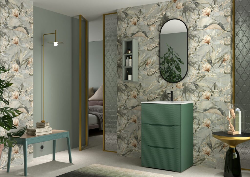 Sage green ribbed 600mm vanity unit with oval mirror against bold botanical-print wall tiles