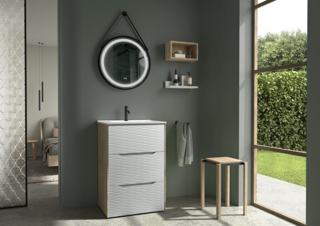 White ribbed 600mm vanity unit with round strap mirror and black tap on a dark green wall