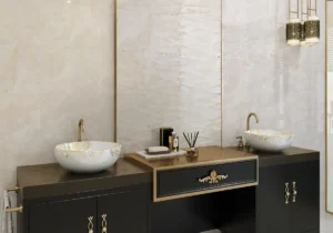 Luxury bathroom with cream wall tiles, dark vanity, gold taps and ornate vessel basins