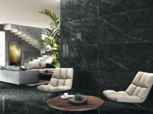 Large-format black marble-look porcelain tiles on walls and floor of a contemporary living room