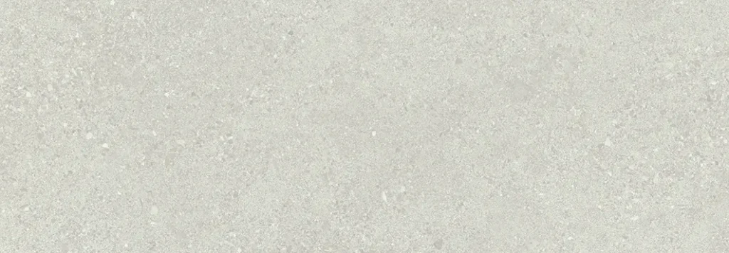 Matt porcelain tile in linen white with scattered stone-look speckles