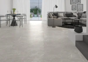 Pearl marble-effect porcelain floor tiles laid in a bright modern open-plan living room