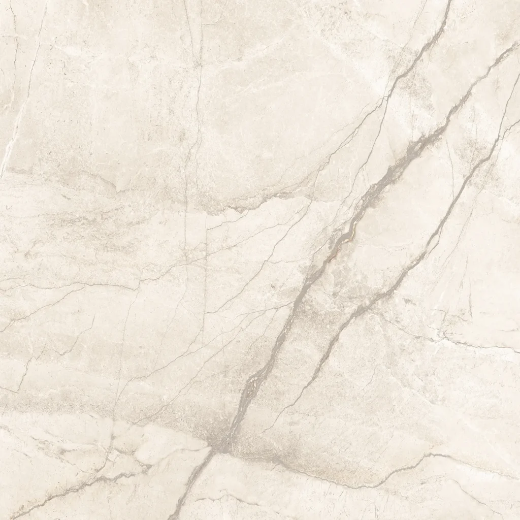 Close-up of ivory matt porcelain tile with bold grey veining and cracked stone detail