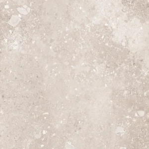 Light beige stone-effect matt porcelain tile with scattered white aggregate detail