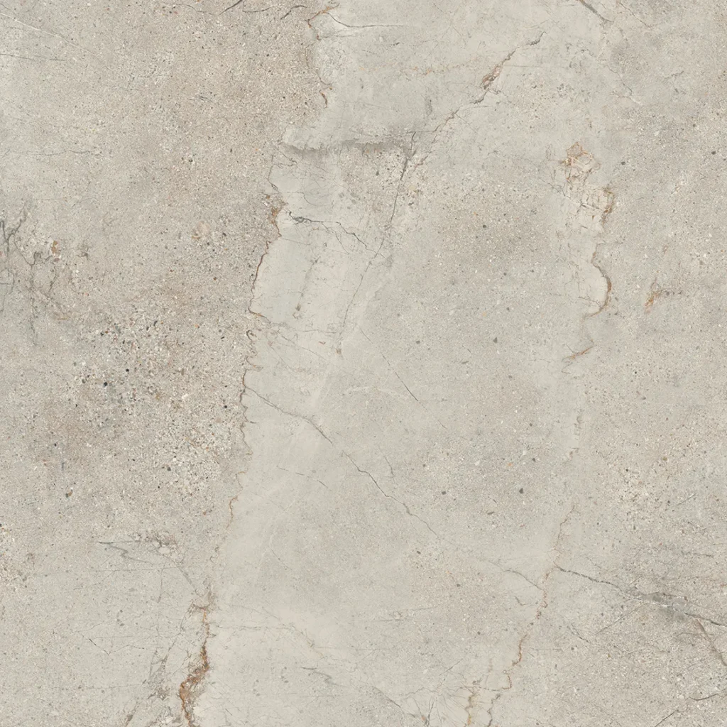 Beige stone-look porcelain tile with jagged central fracture and earthy flecks