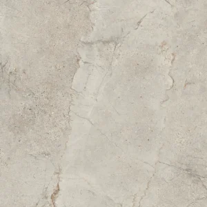 Beige stone-look porcelain tile with jagged central fracture and earthy flecks