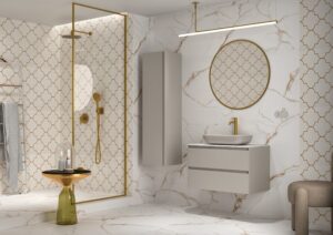 Light grey vanity unit with vessel basin and gold tap against white marble and arabesque tiled walls