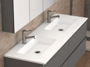 White double inset washbasin on grey wall-hung vanity unit with chrome taps