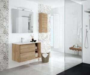 Light oak wall hung vanity with open shelf and white basin beside a glass shower enclosure