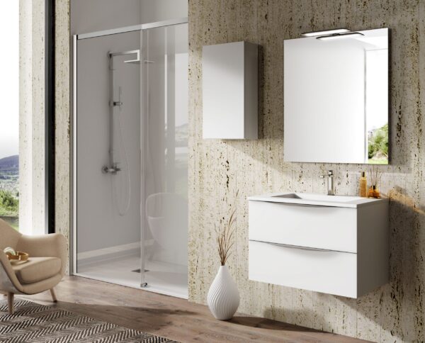 Gloss white 700mm wall hung vanity with chrome handle beside glass shower