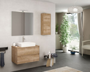 Natural oak vanity unit with white countertop basin, lit mirror and matching wall cabinet in a bright room