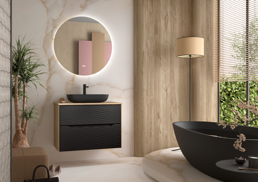 Black ribbed two-drawer vanity unit with oak top and black vessel basin beside freestanding bath