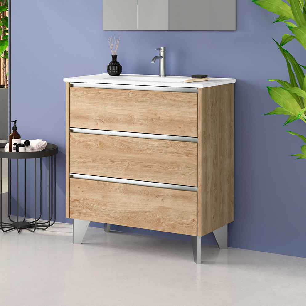 Oak-finish three-drawer freestanding vanity unit with chrome handles and white basin