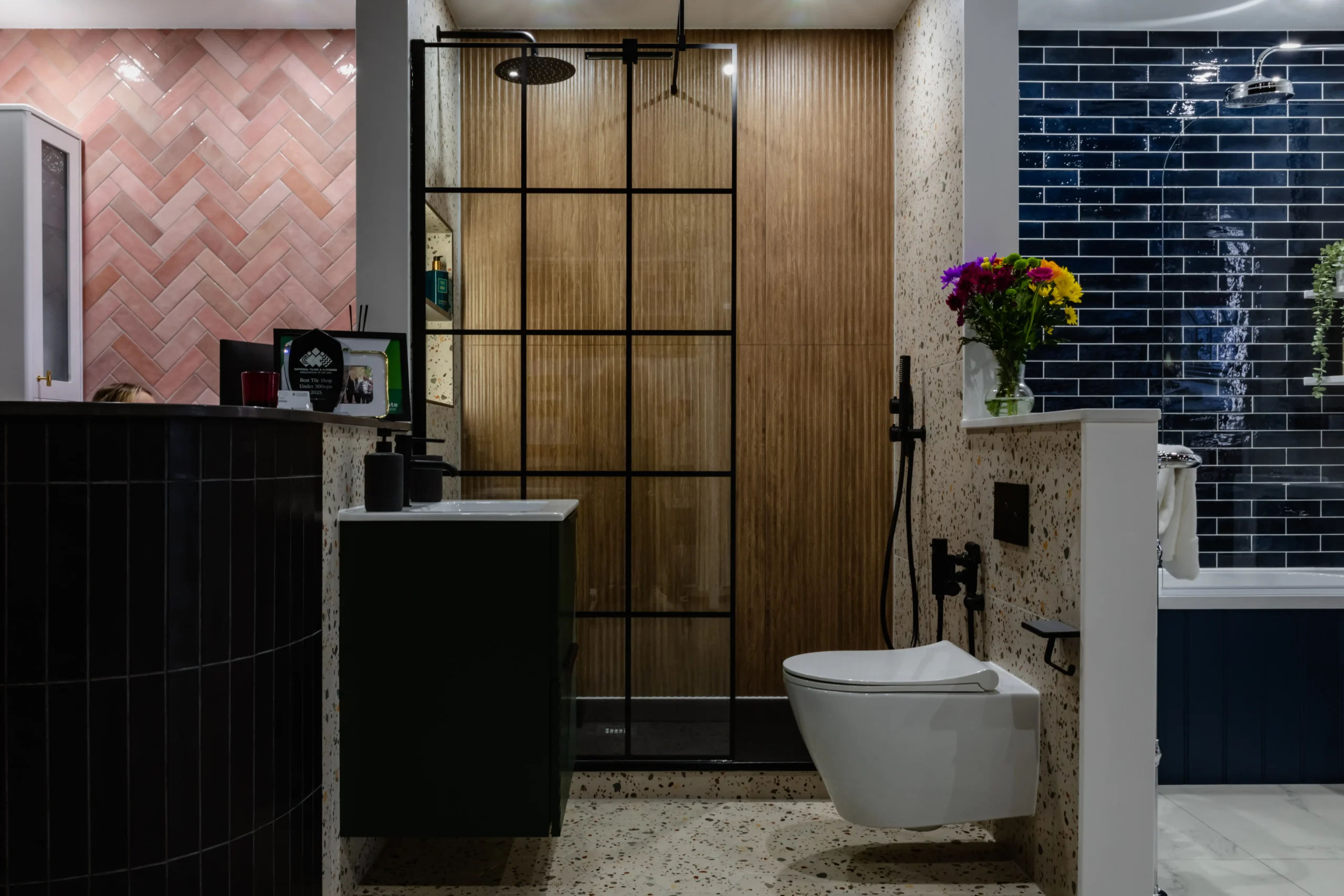 Walk-in shower room with a glass screen and tiled enclosure on display in the Newlook Tiles and Bathrooms Dublin showroom