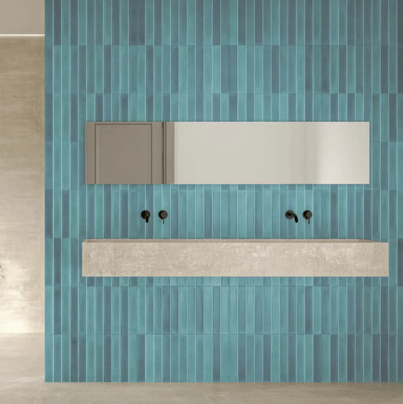 Teal vertical ribbed ceramic tiles covering a full bathroom feature wall