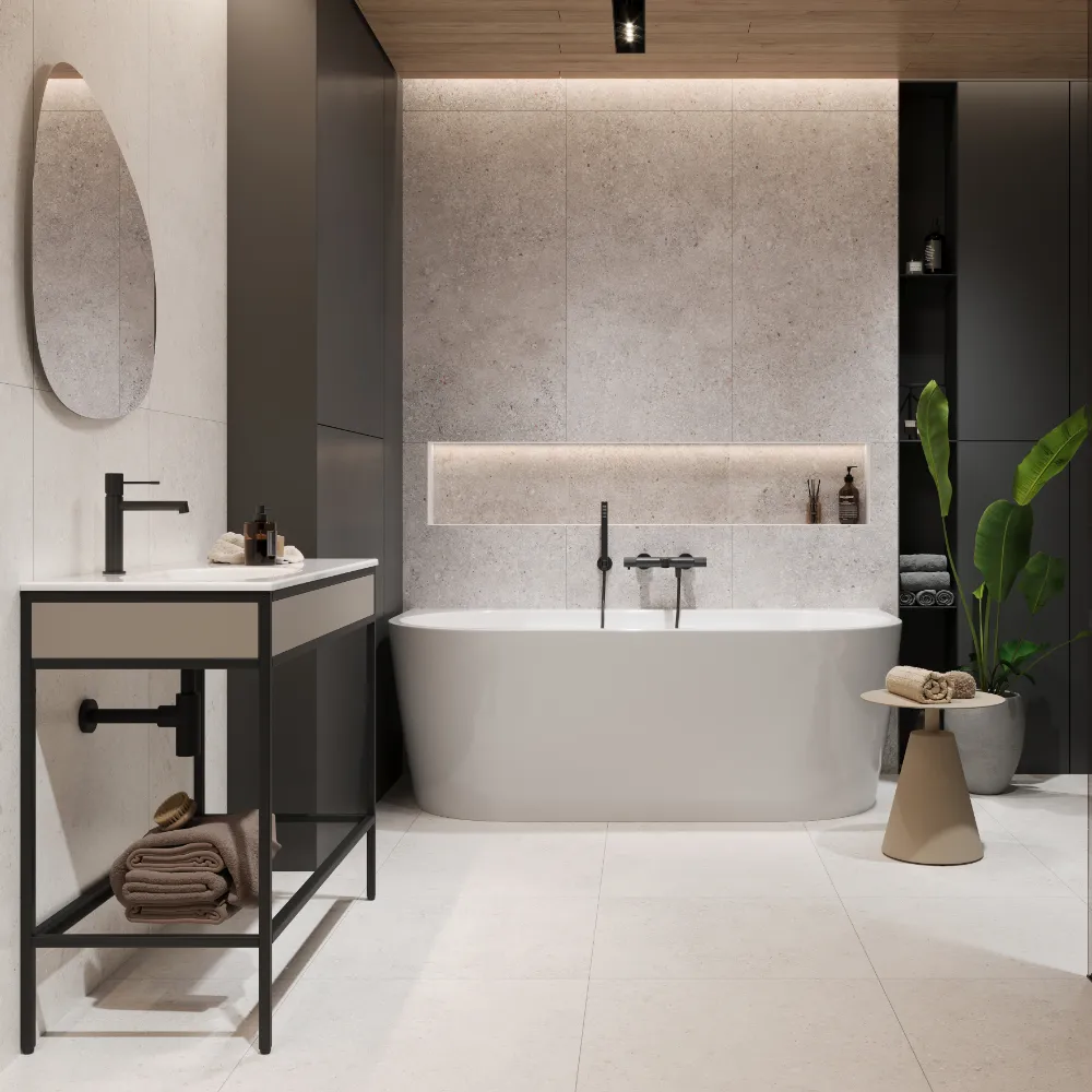 White matt stone-effect porcelain tiles on a modern bathroom wall behind a freestanding bath