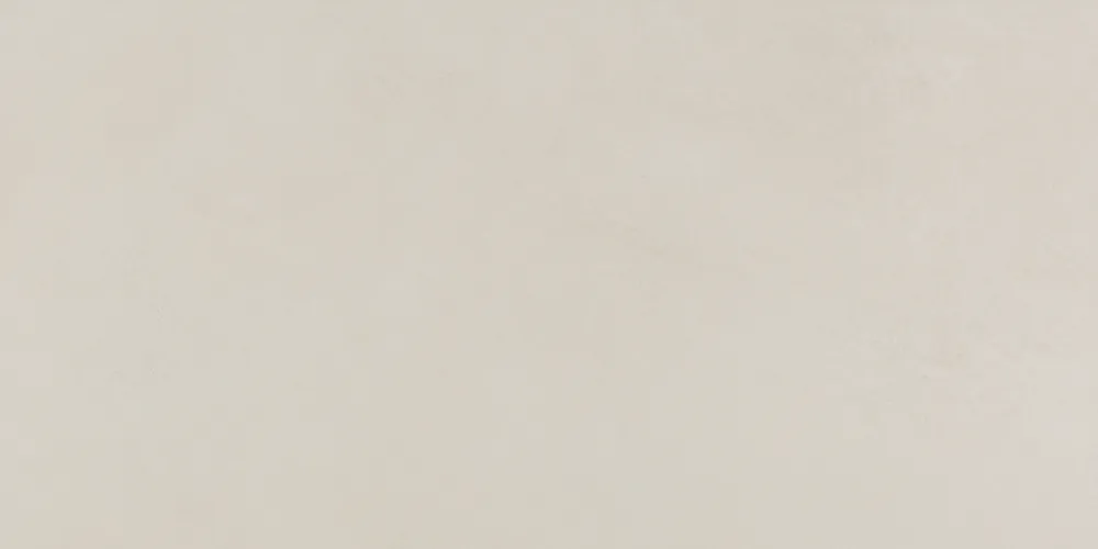Close-up of a plain cream matt porcelain tile surface