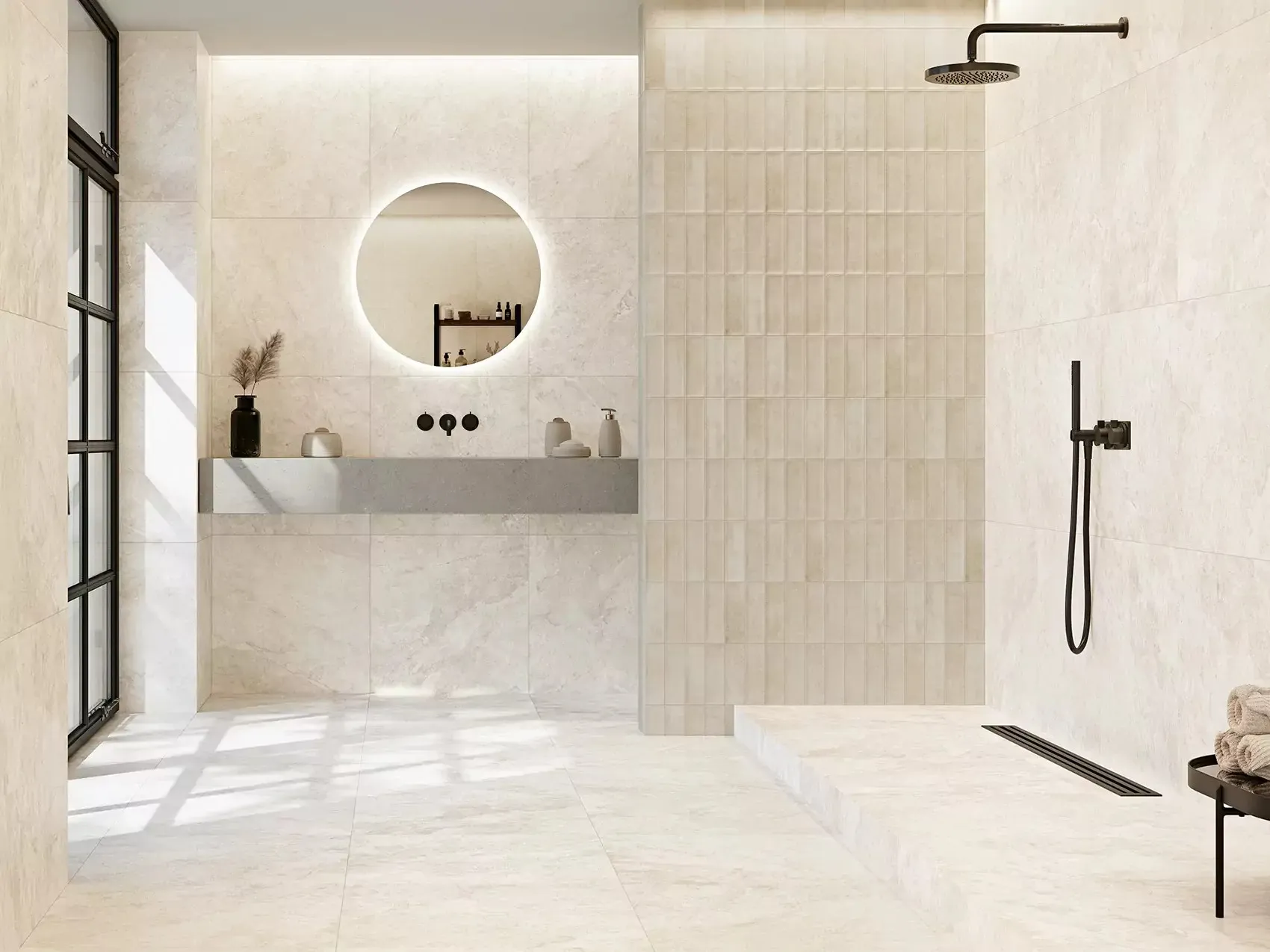Cream stone-effect tiles covering walls and floor of an open walk-in shower